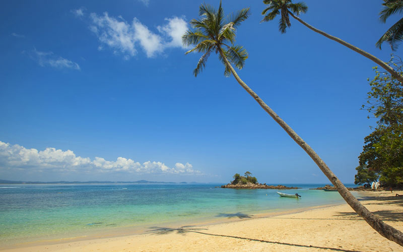 white beach, sand, summer, sunshine, boat, island, blue sky, palm trees, vacation