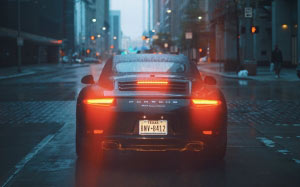 buildings, car, skyscrapers, city, porsche, rainy, road, street, urban, vehicle, wet