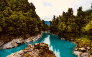 new zealand, river, landscape, rocky, stones, forest, trees, woods, nature, wilderness, lake, clouds, blue