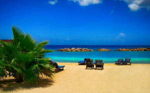 beach, sea, coast, water, sand, ocean, horizon, sun, shore, summer, vacation, travel, tranquility, paradise, palm, lagoon, calm, bay, island, rest, body of water, rocks, cruise, chairs, relaxation, meditation, serenity, caribbean, sandy beach, tropics