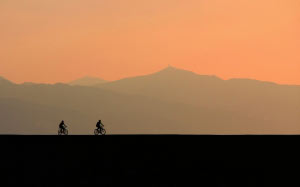 backlit, bicycles, clouds, cyclist, dawn, dusk, evening, landscape, mist, mountain, nature, outdoors, scenic, silhouette, sky, sunset, travel