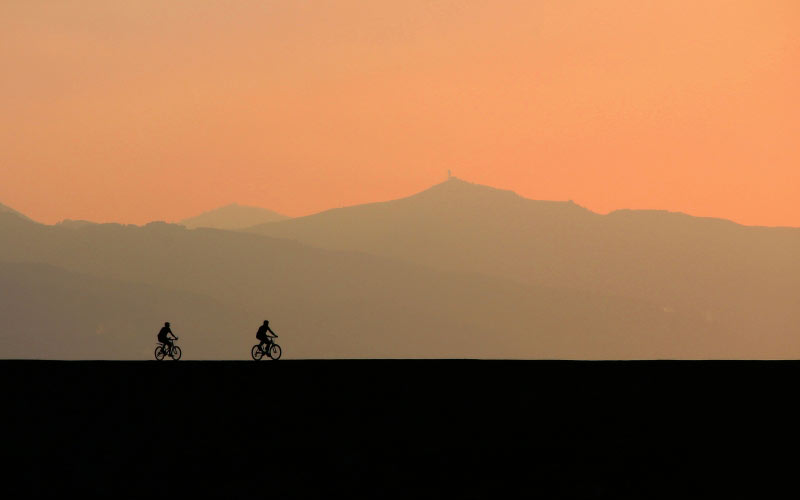 backlit, bicycles, clouds, cyclist, dawn, dusk, evening, landscape, mist, mountain, nature, outdoors, scenic, silhouette, sky, sunset, travel