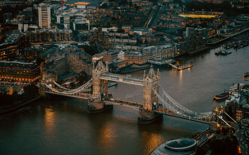 cityscape, aerial photography, city, metropolitan area, water, urban area, metropolis, bridge, river, night, waterway, skyline, downtown, architecture, harbor, landscape, bird