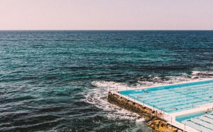 ocean waves, pool, aerial, resort, seashore, swimming, coast, shore, ocean, sea, waves, water, sky, horizon, horizon over water, outdoors, scenics, nature, beach, clear sky, tranquility, blue, swimming pool